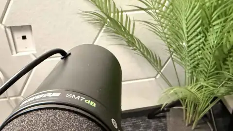 Shure SM7dB microphone capturing audio in a San Antonio podcast studio
